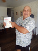 Ron Lanzo smiling and holding his book, Networking Works